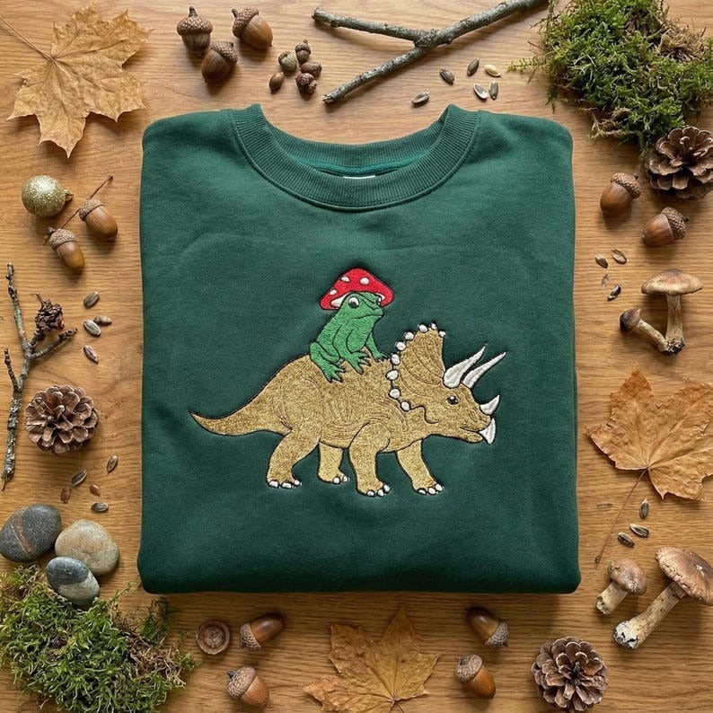 Embroidered Frog Riding Triceratops Sweatshirt, Cottagecore Crewneck, Frog Mushroom Shirt, Toad Dino Gift, Embroidered T-Shirt