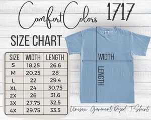 Blue t-shirt with size chart on a wooden background